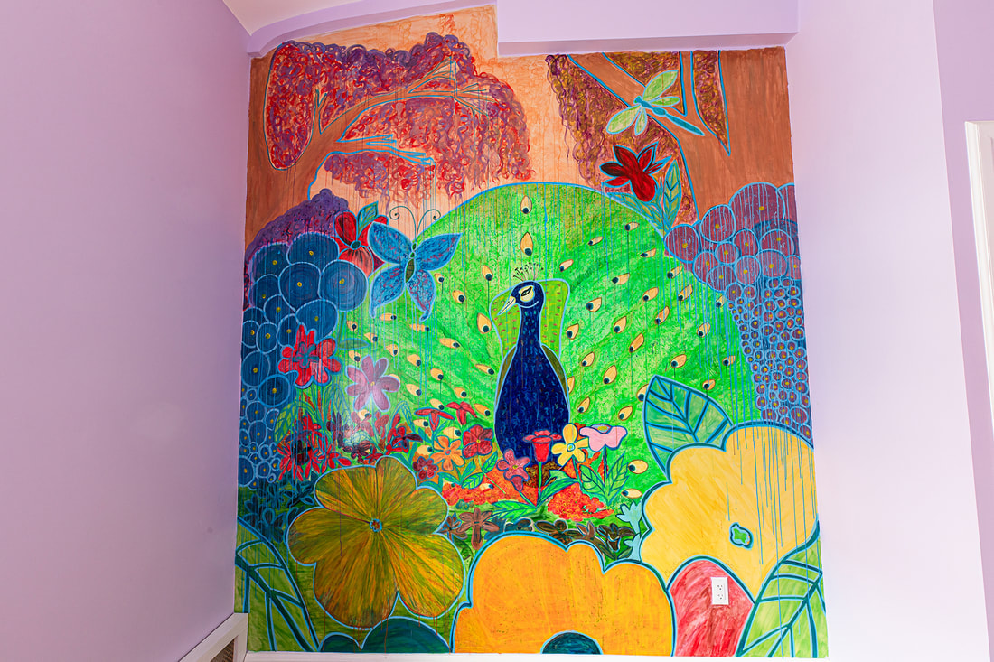 An indoor peacock mural by Christine Sloan Stoddard