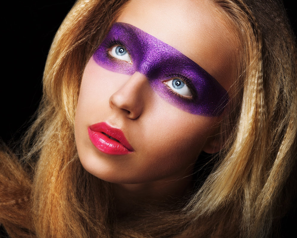 White female model with purple glitter mask