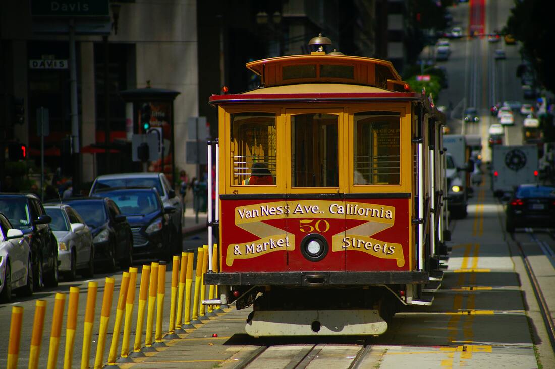 A red and yellow trolley with the words 